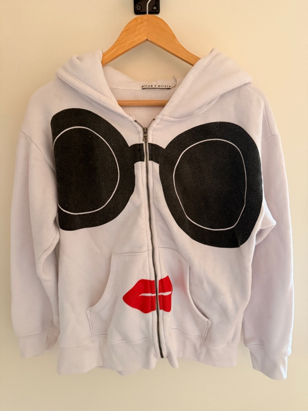 Alice + Olivia Stace Face White Zip Hoodie with Black Sunglasses & Red Lips
